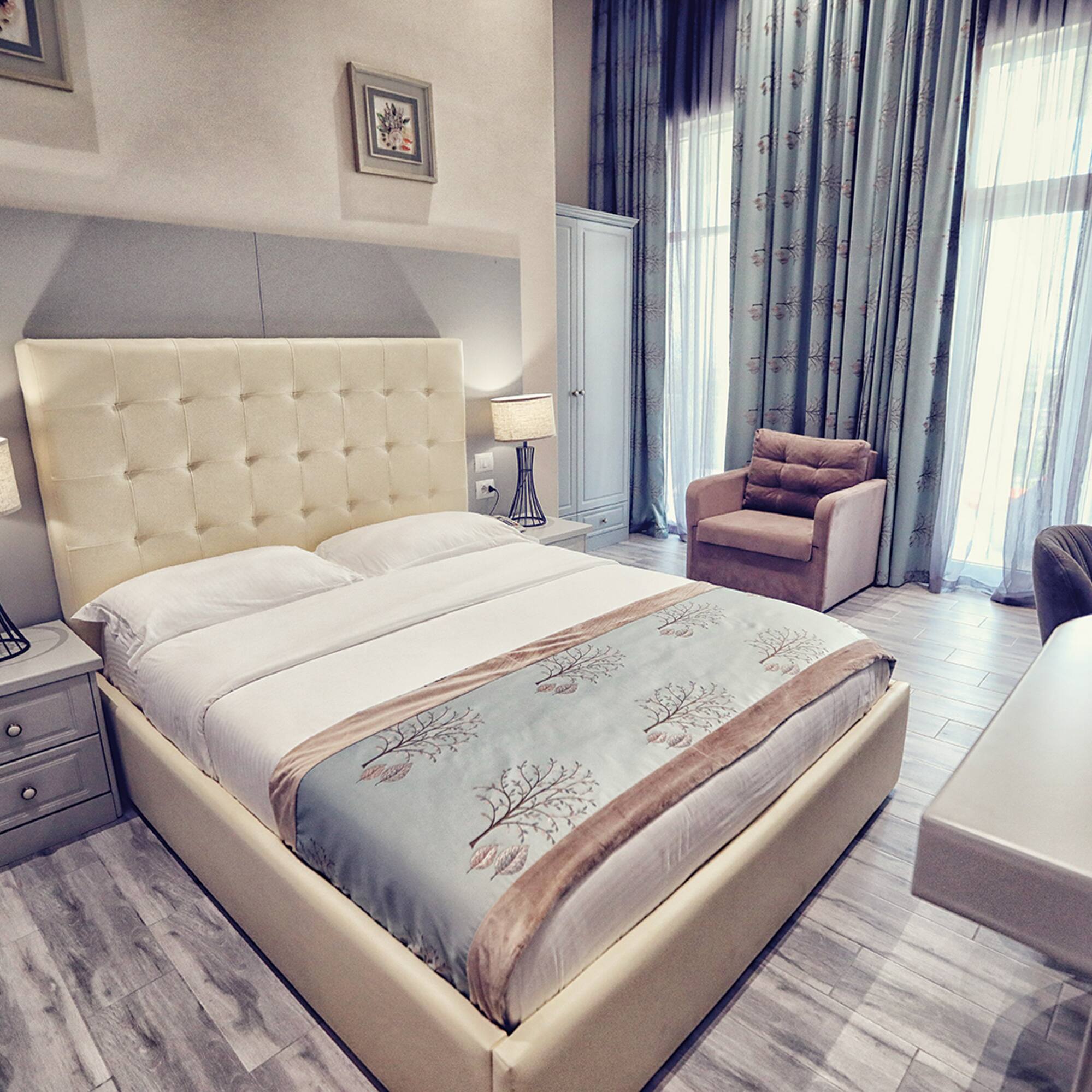 a bedroom with a bed and a desk