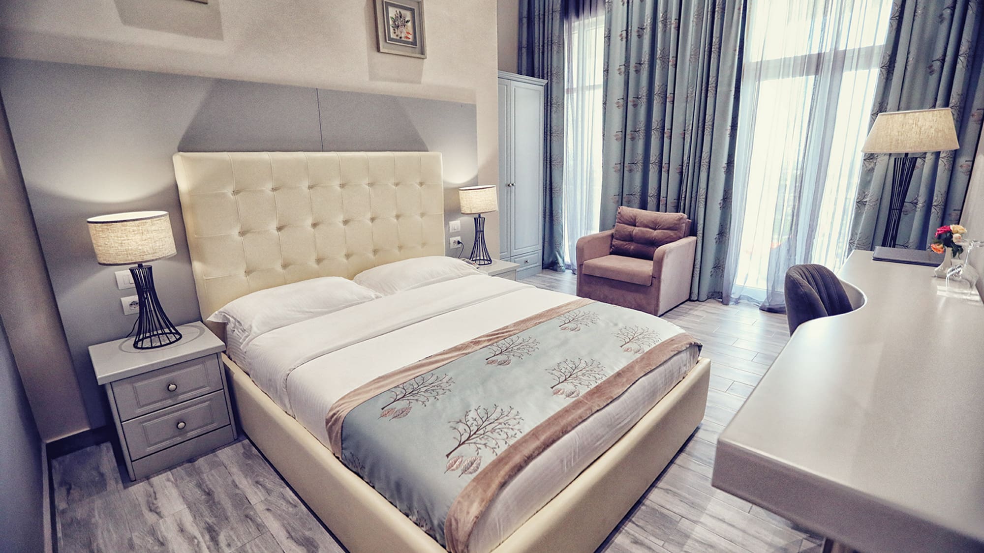 a bedroom with a bed and a desk