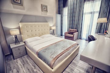 a bedroom with a bed and a desk