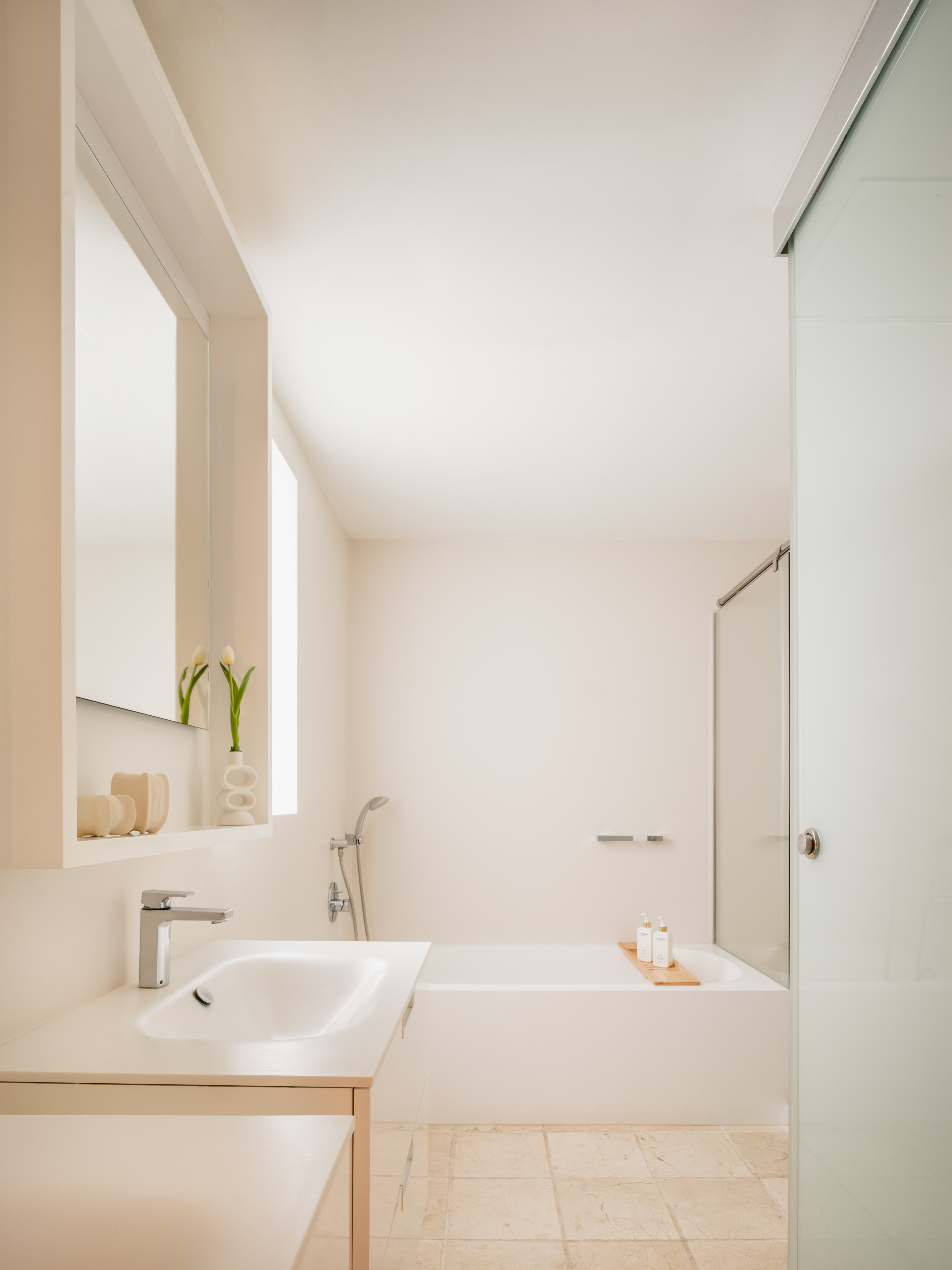 a bathroom with a bathtub and sink