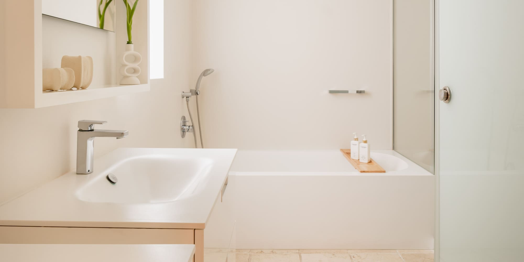 a bathroom with a bathtub and sink