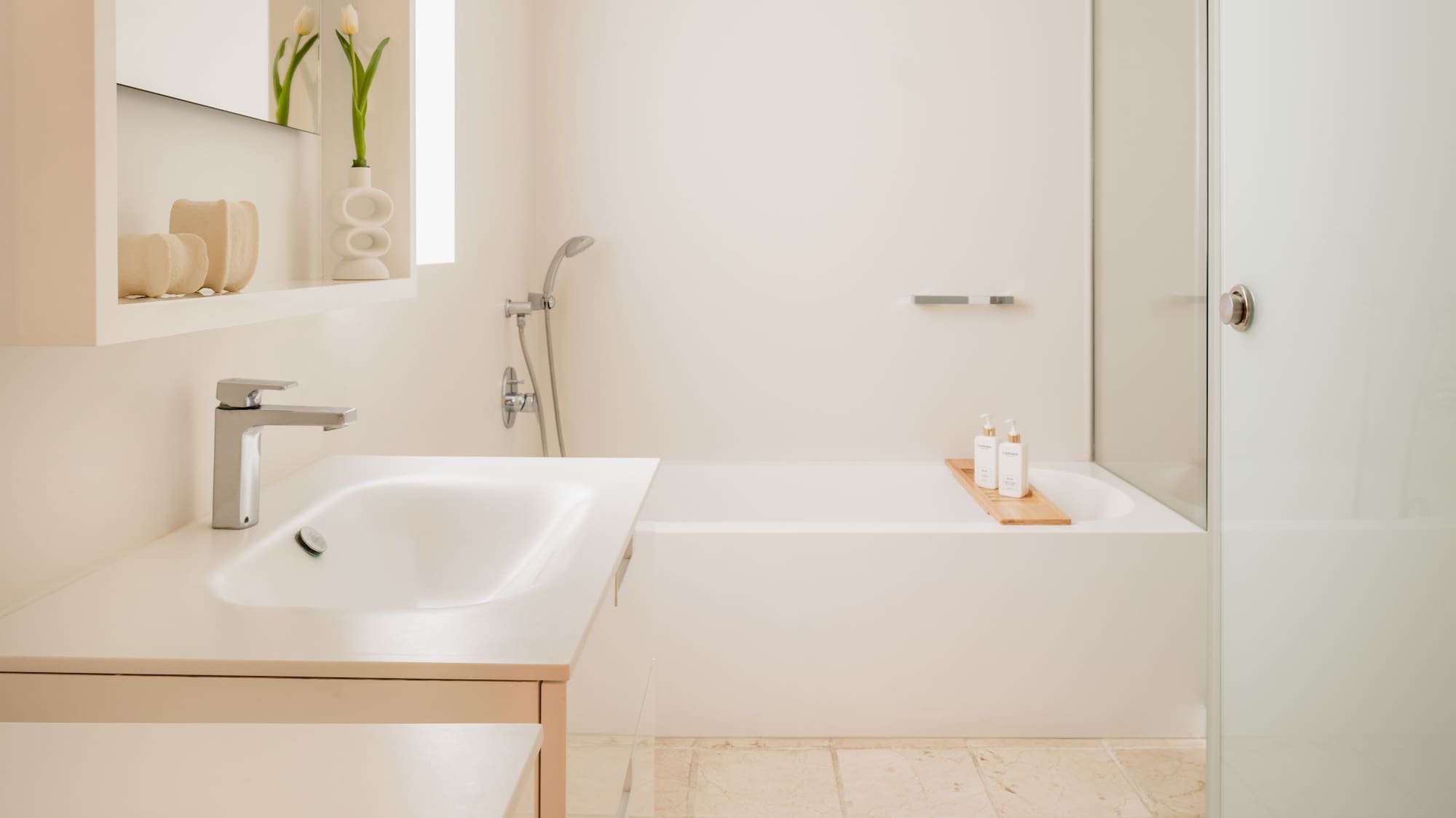 a bathroom with a bathtub and sink