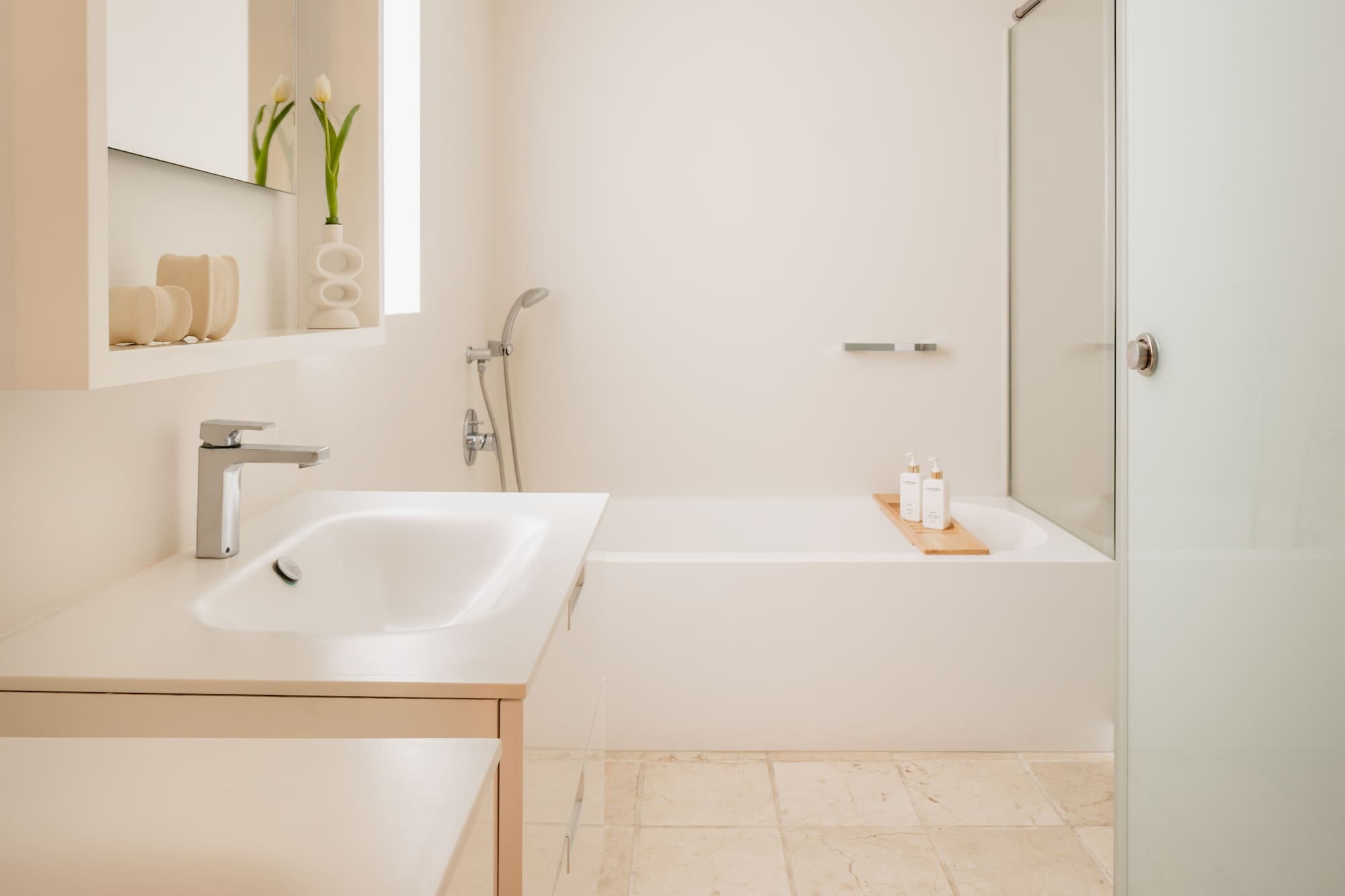 a bathroom with a bathtub and sink