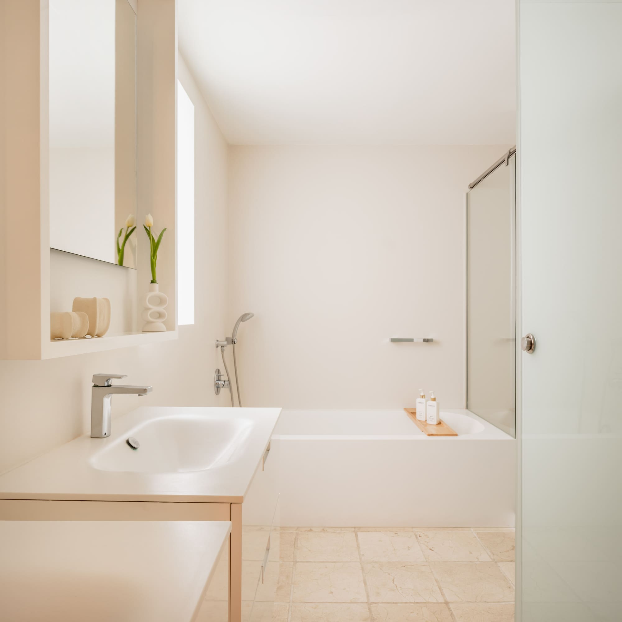 a bathroom with a bathtub and sink