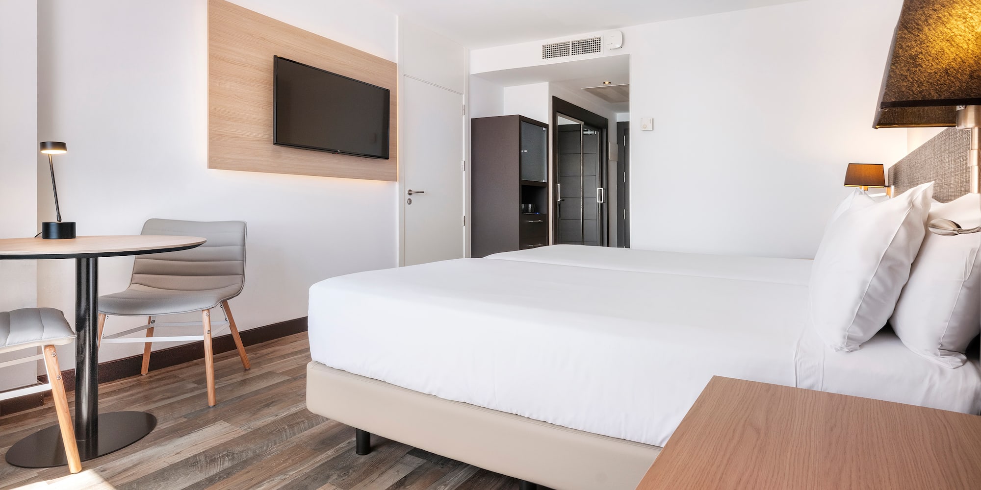 a room with a bed and a table