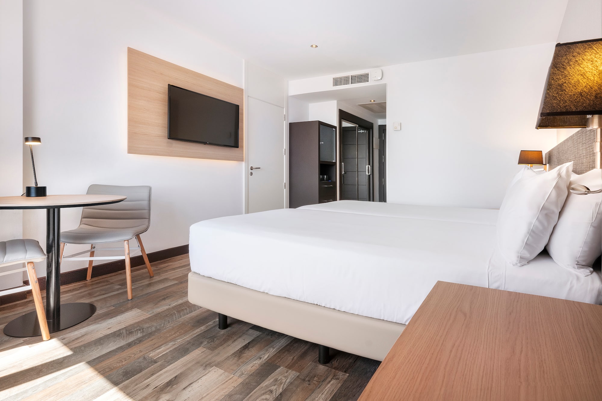 a room with a bed and a table