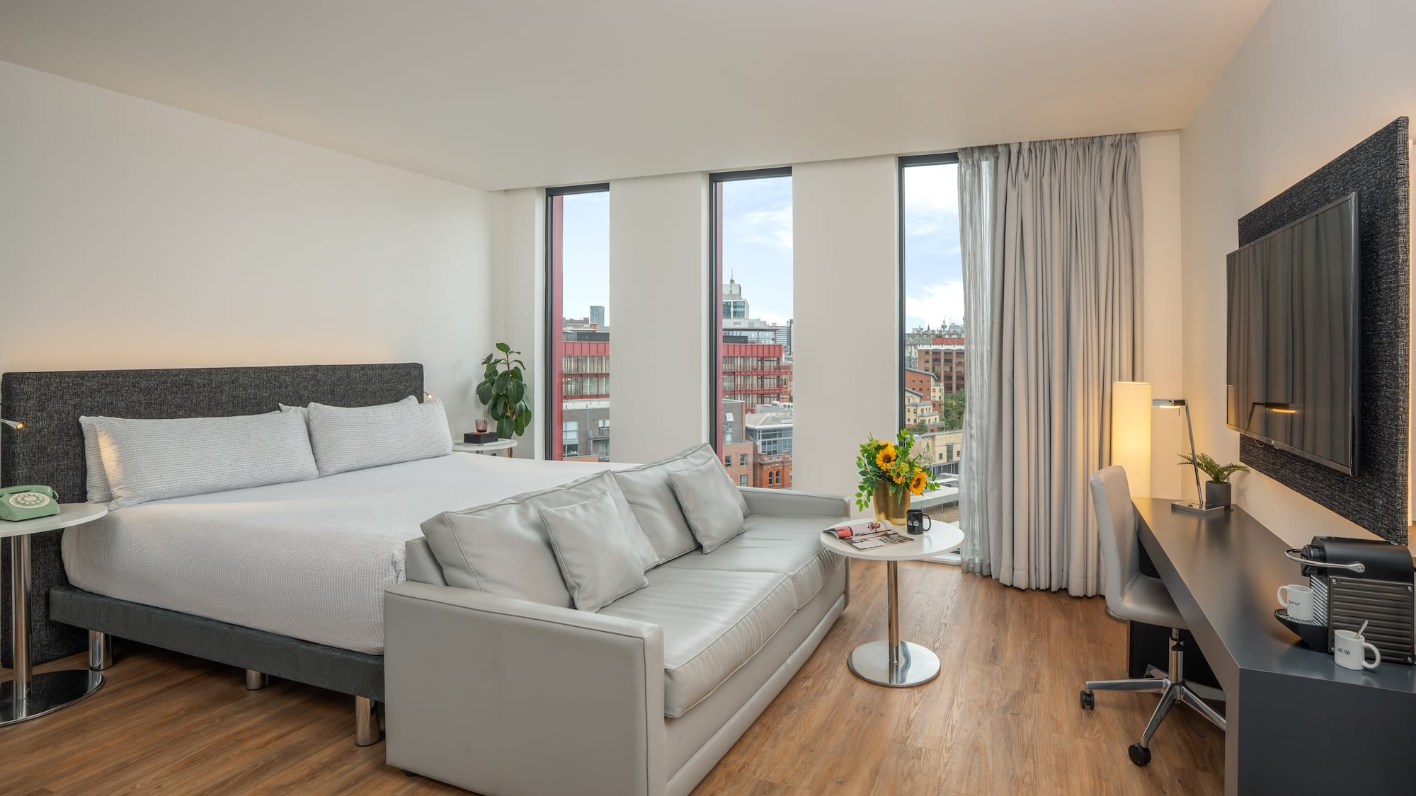 a room with a bed and a desk