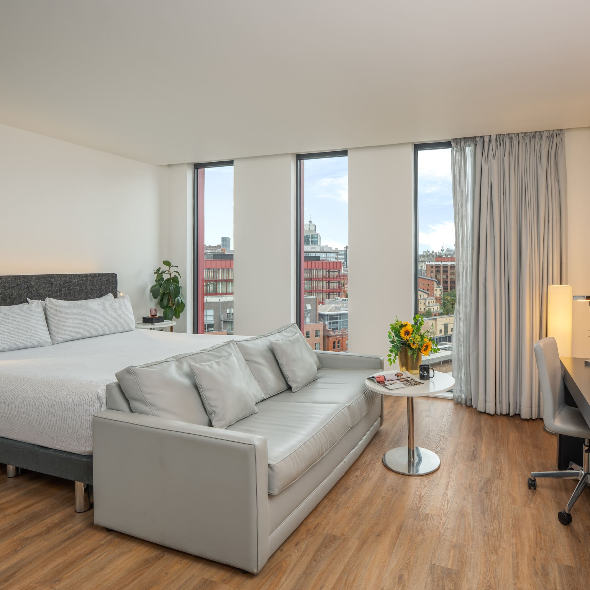 a room with a bed and a desk