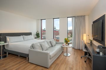 a room with a bed and a desk