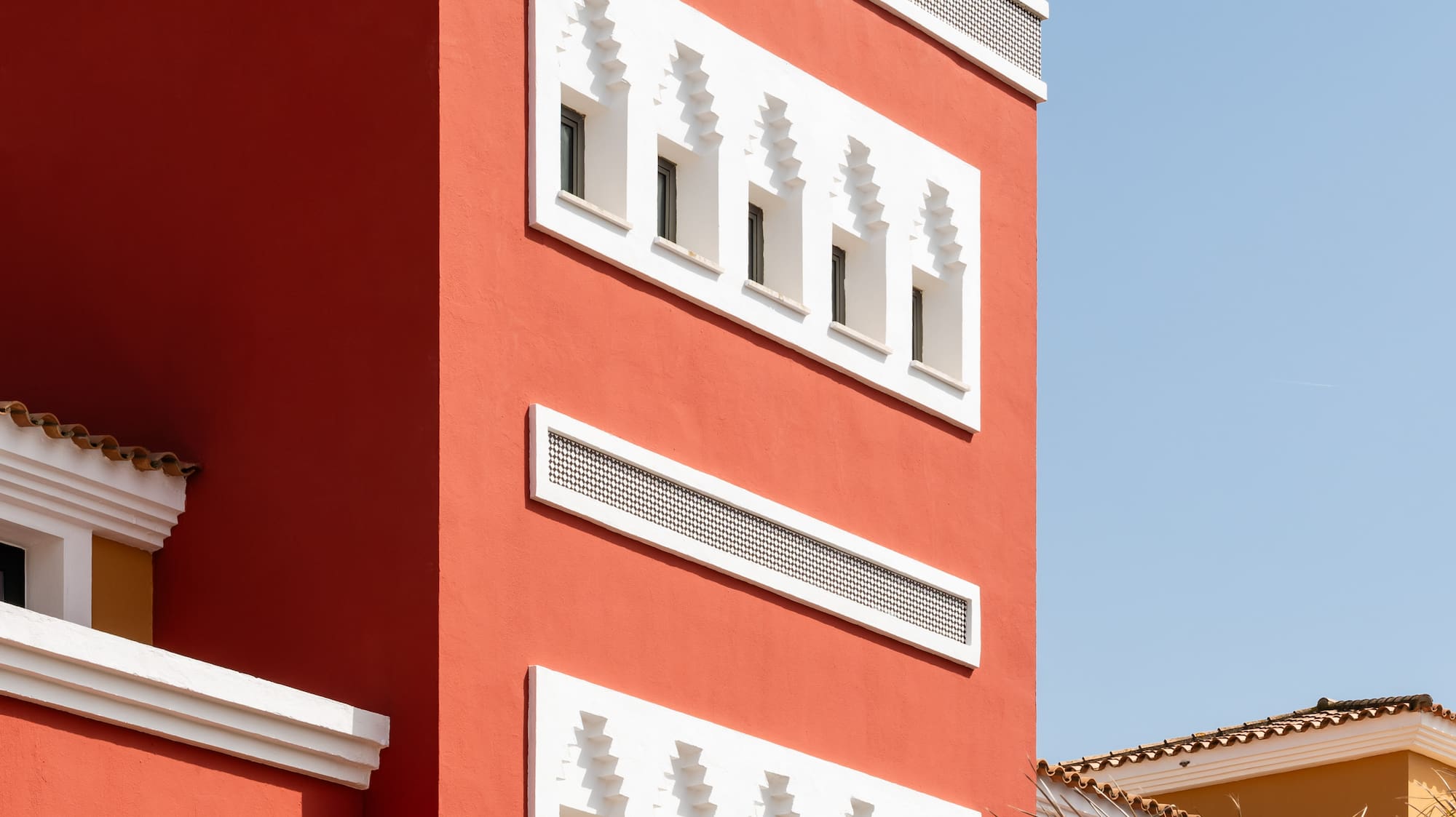 a red building with white trim