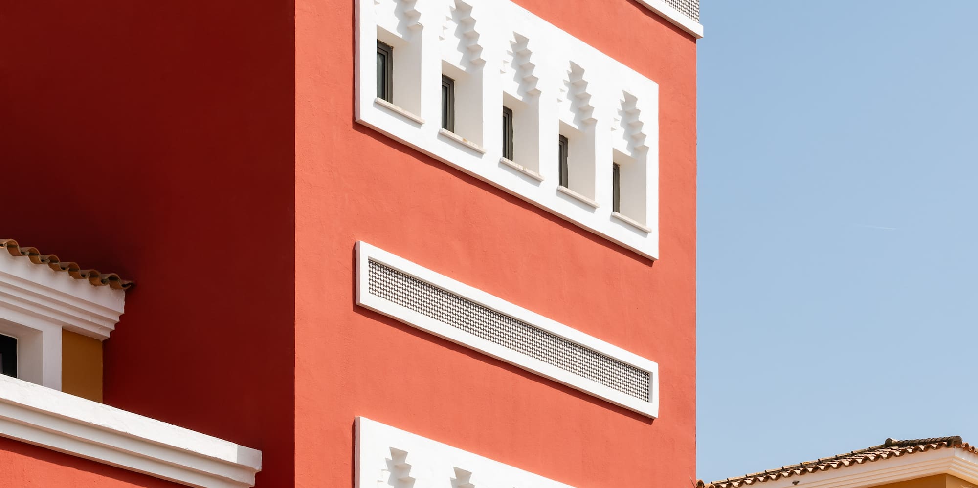 a red building with white trim