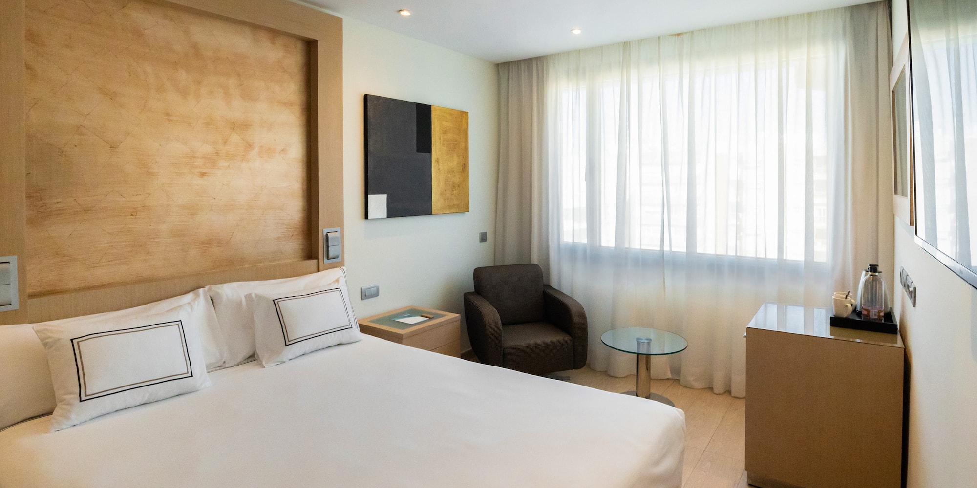 a room with a bed and a chair