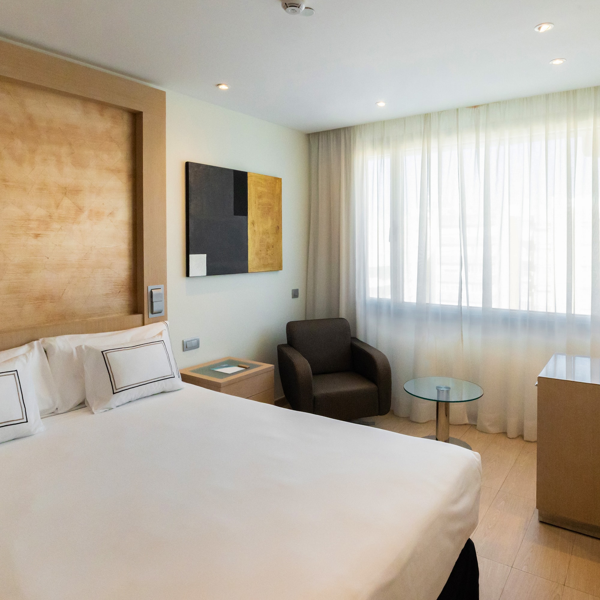 a room with a bed and a chair