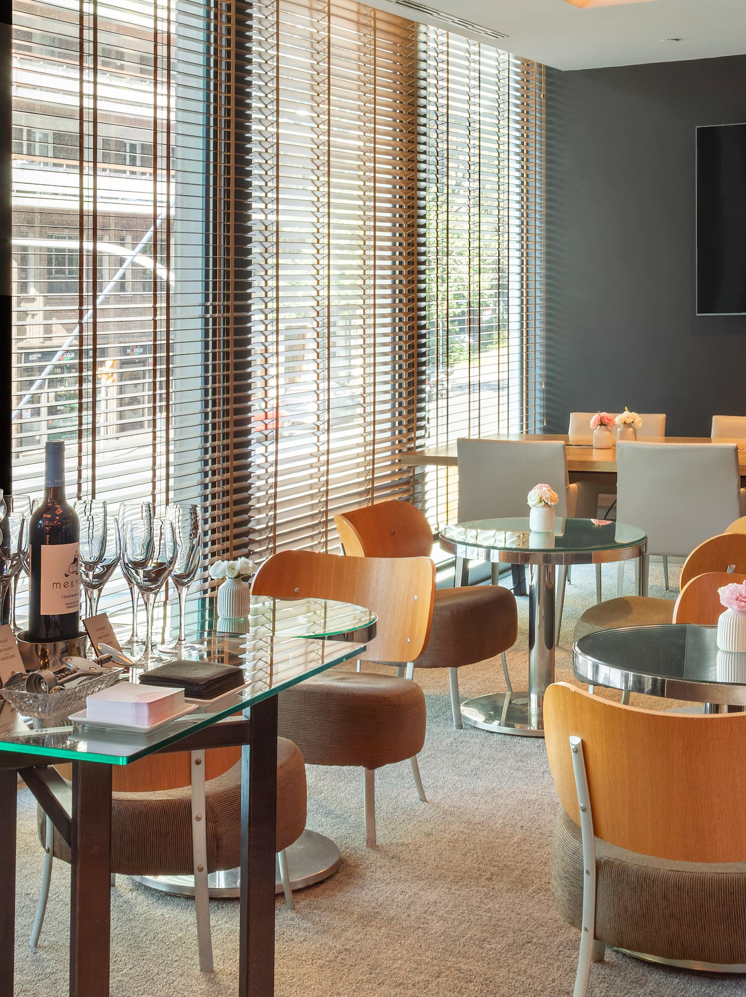 a room with a table and chairs and a television