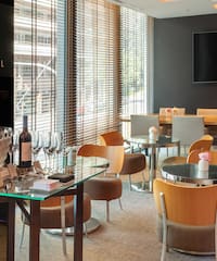 a room with a table and chairs and a television