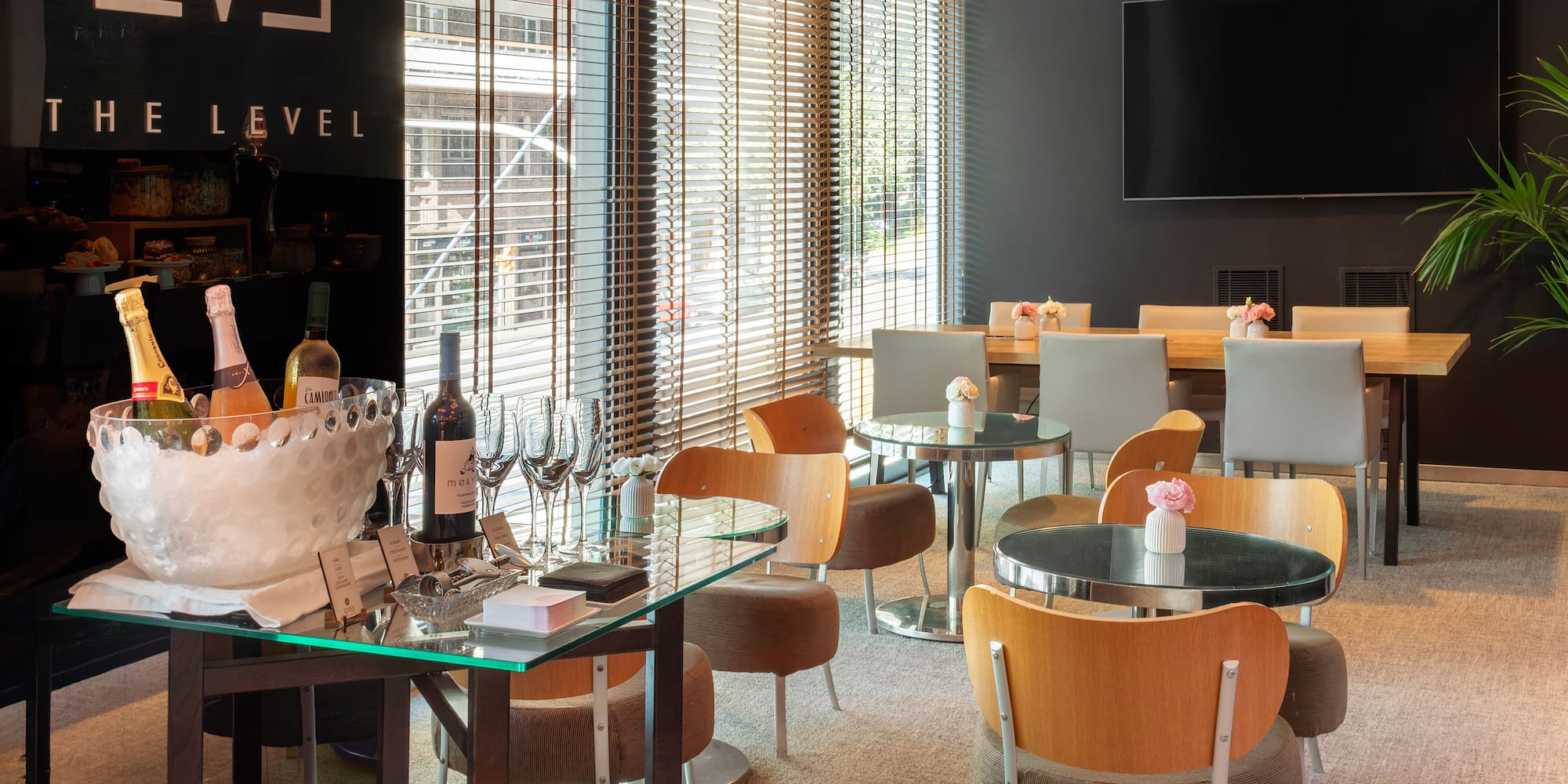 a room with a table and chairs and a television