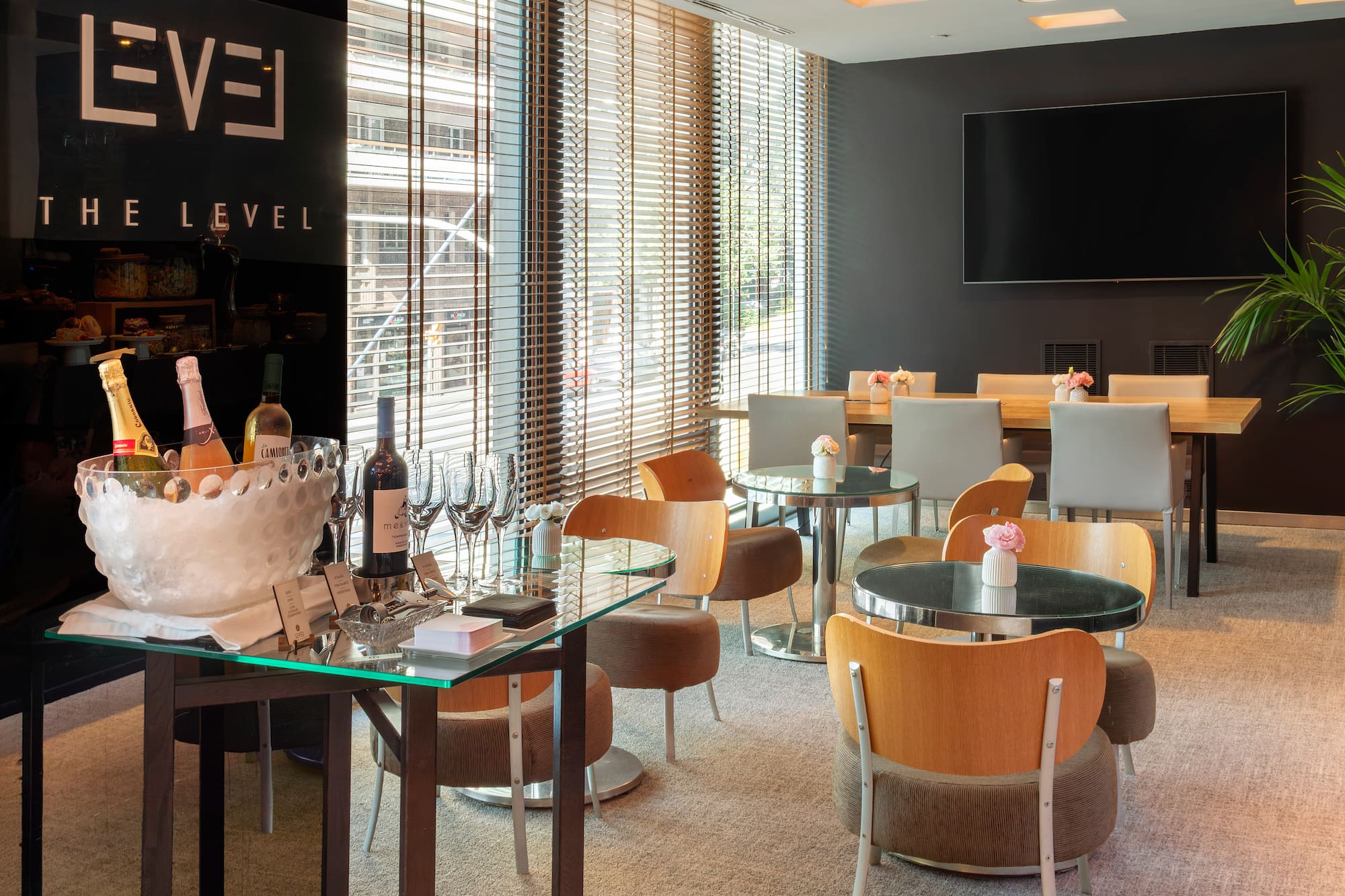 a room with a table and chairs and a television