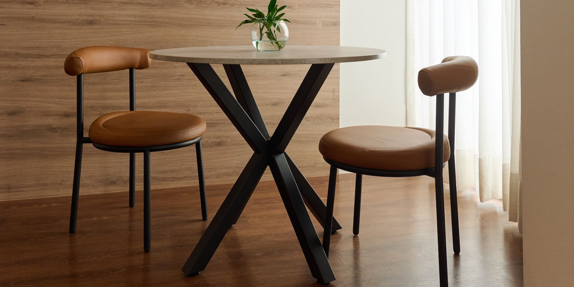 a table with chairs in a room