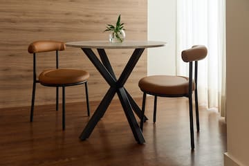 a table with chairs in a room