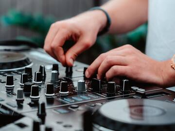 a person using a dj mixer