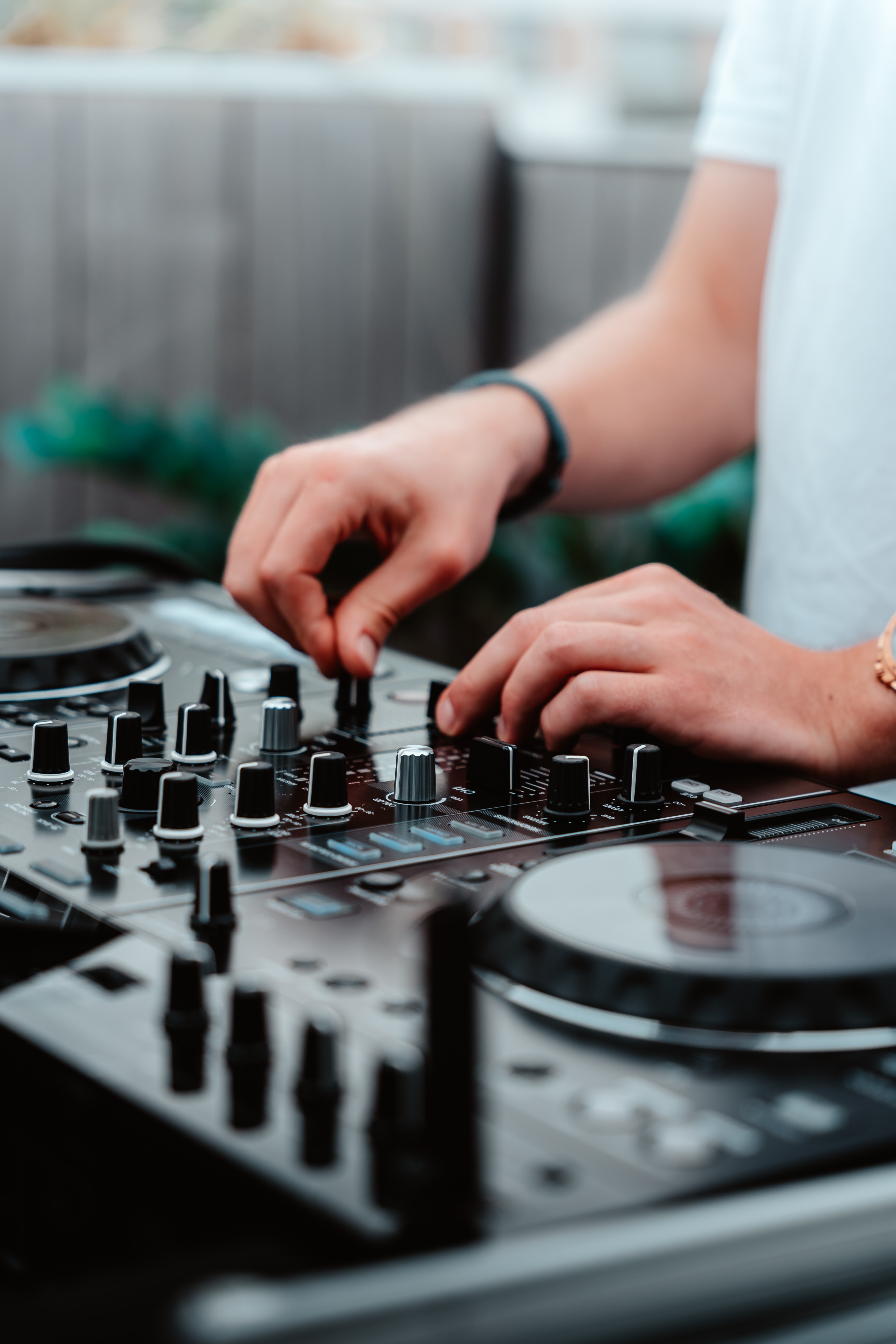 a person using a dj mixer