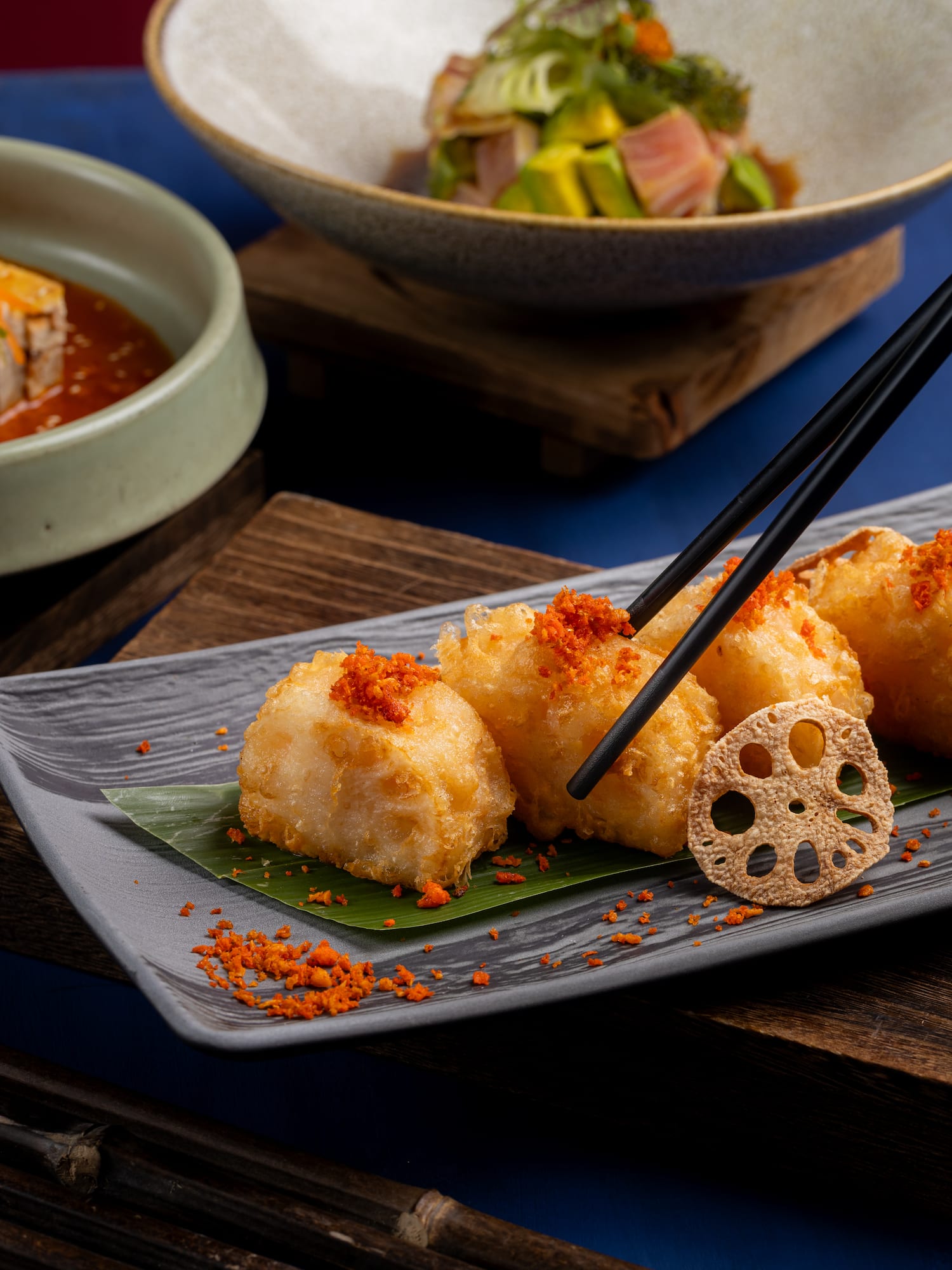 a plate of food with chopsticks
