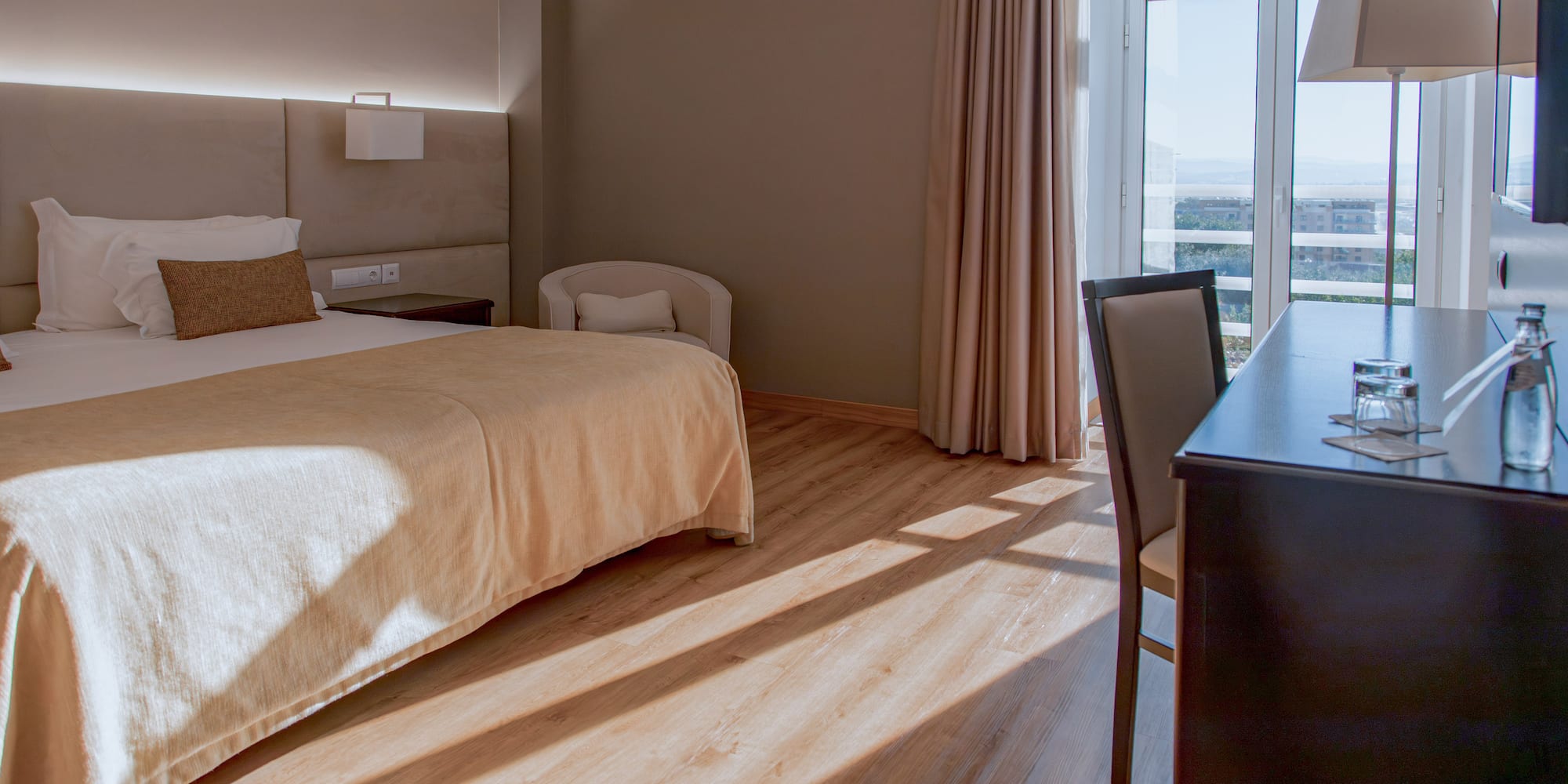 a room with a bed and a desk