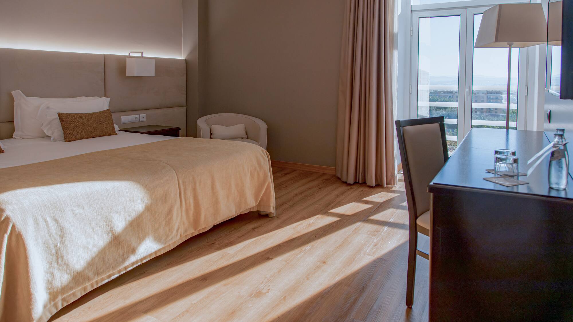 a room with a bed and a desk