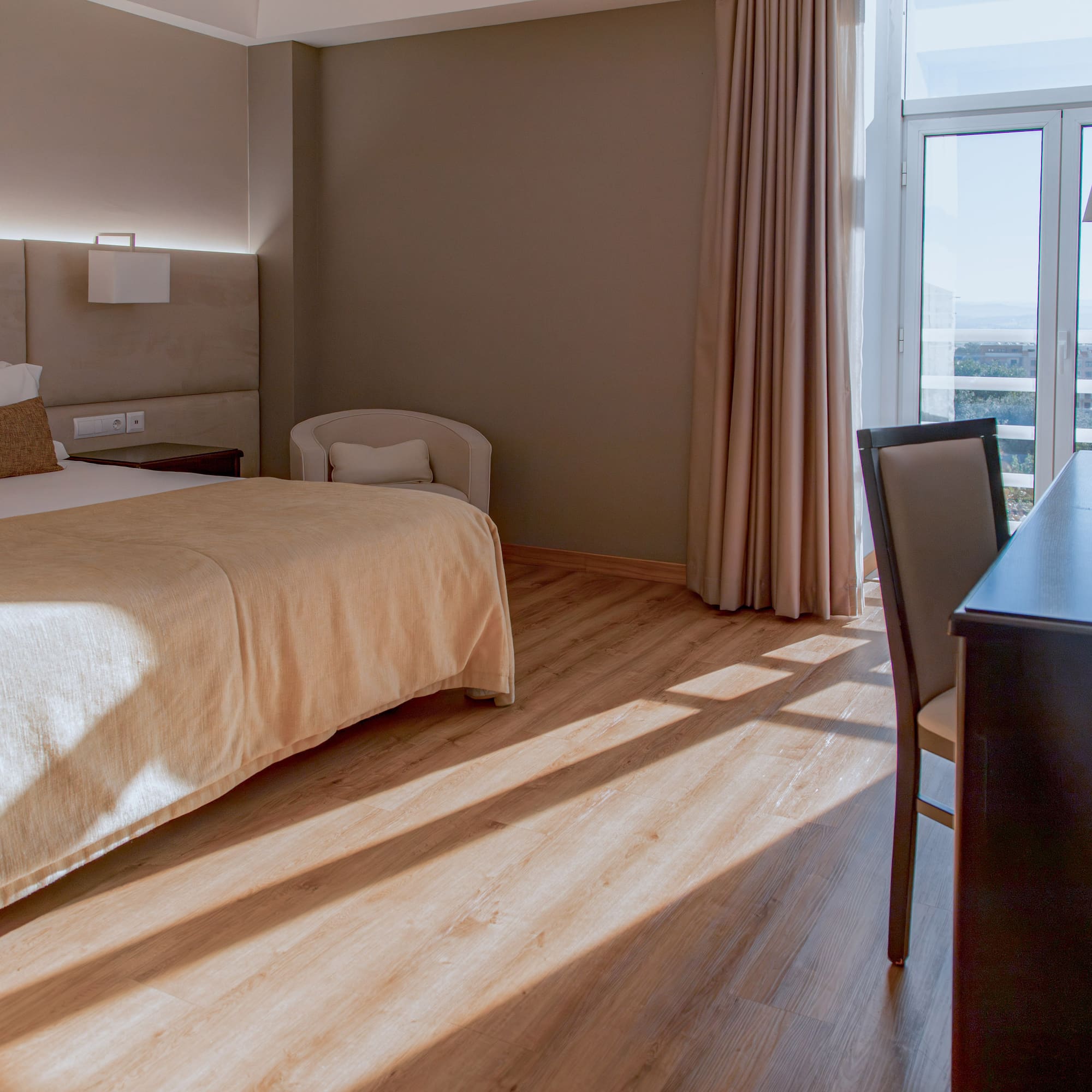 a room with a bed and a desk