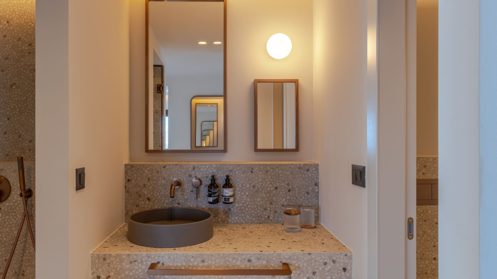 a bathroom with a sink and mirror