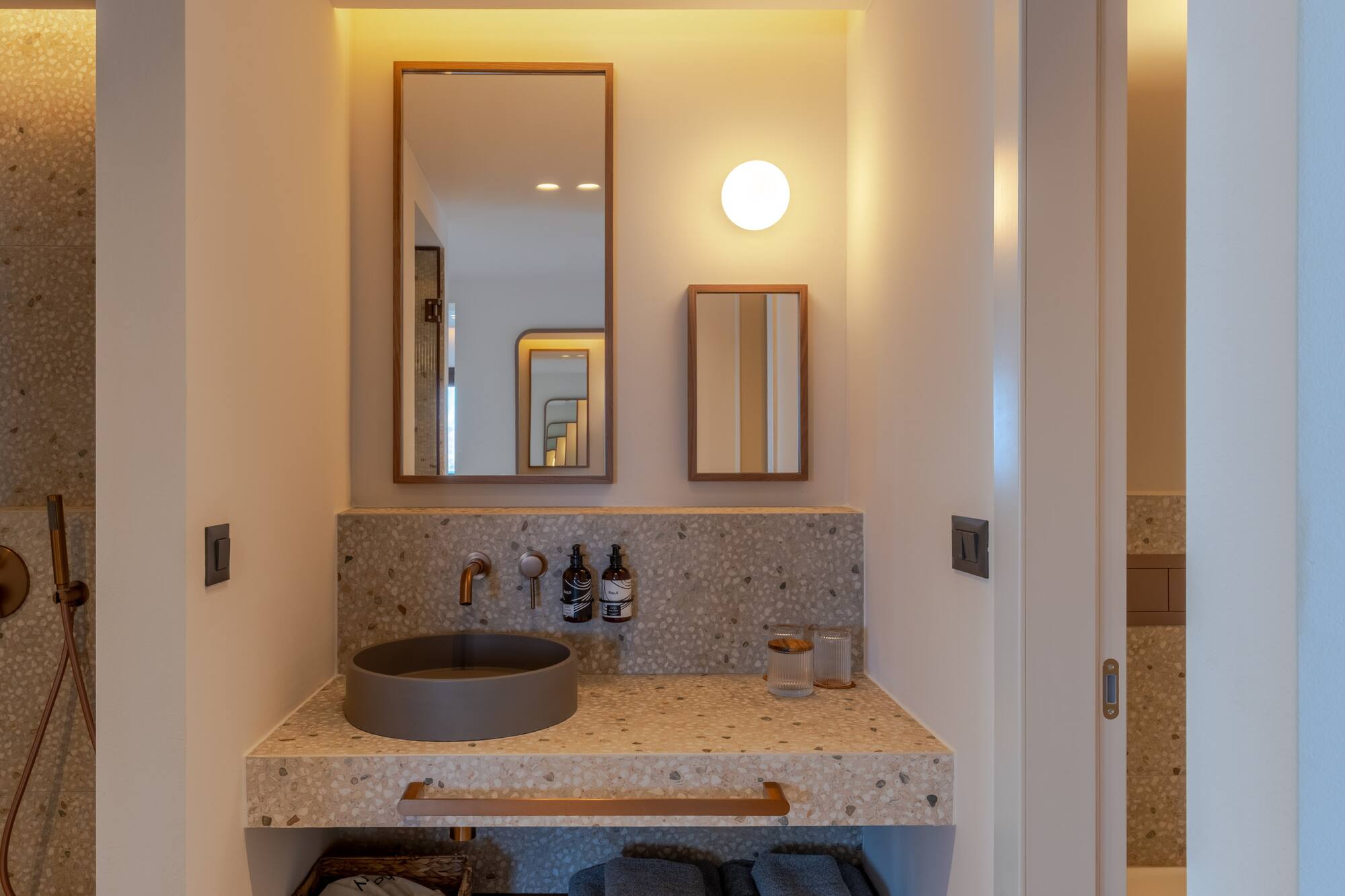 a bathroom with a sink and mirror