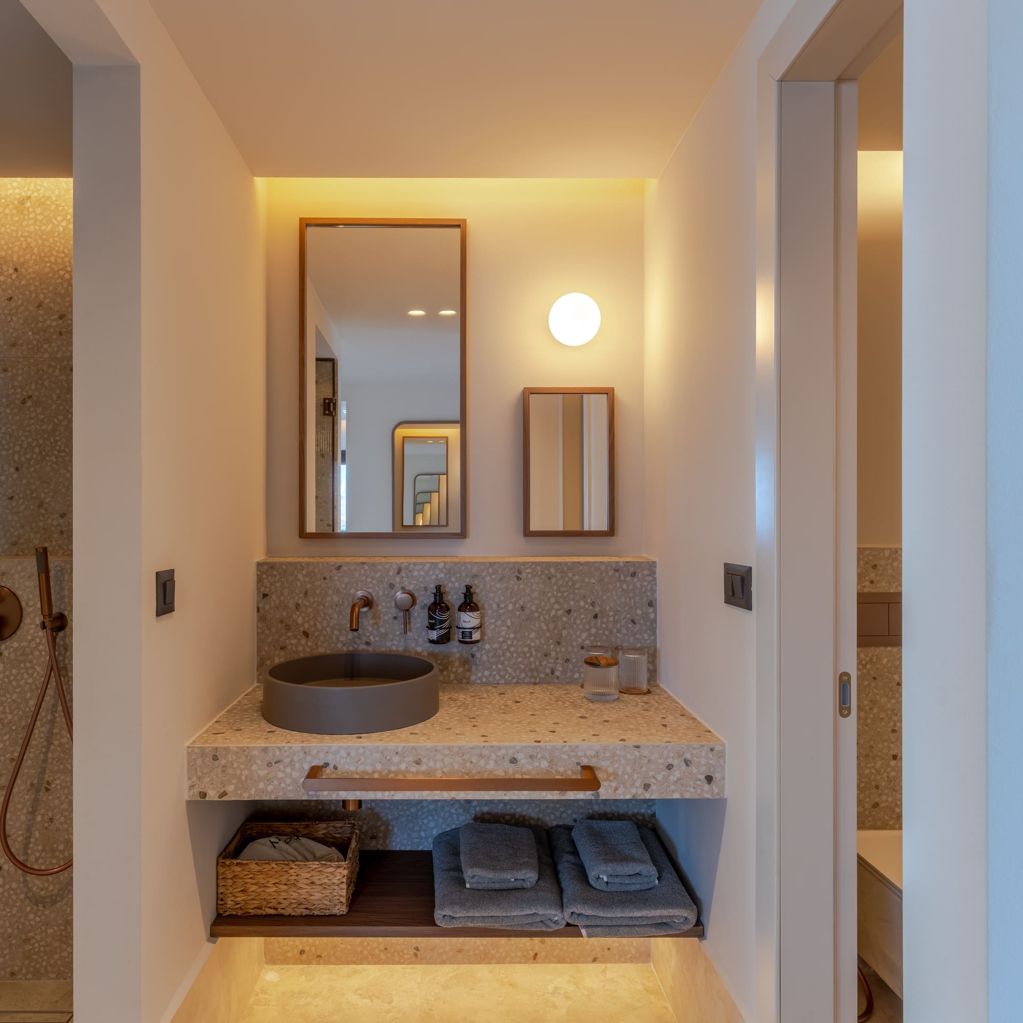 a bathroom with a sink and mirror