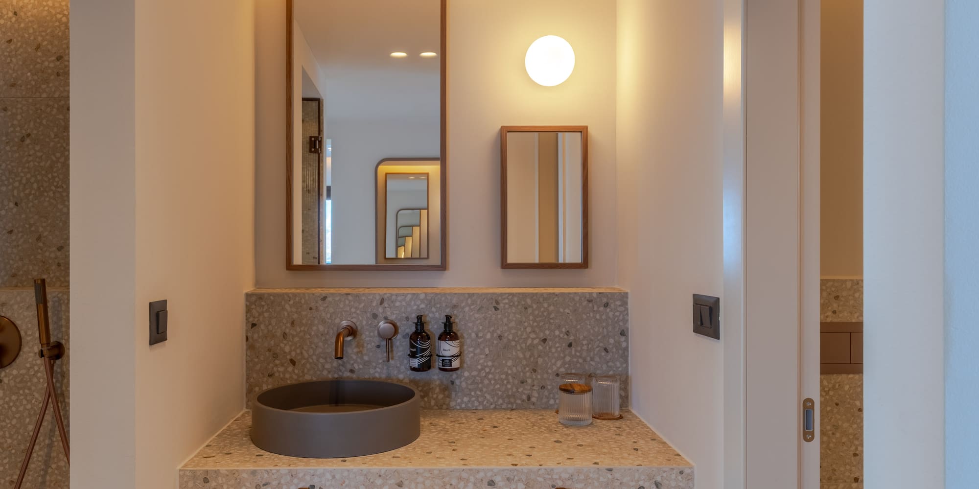 a bathroom with a sink and mirror