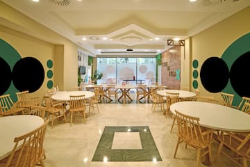 a room with tables and chairs