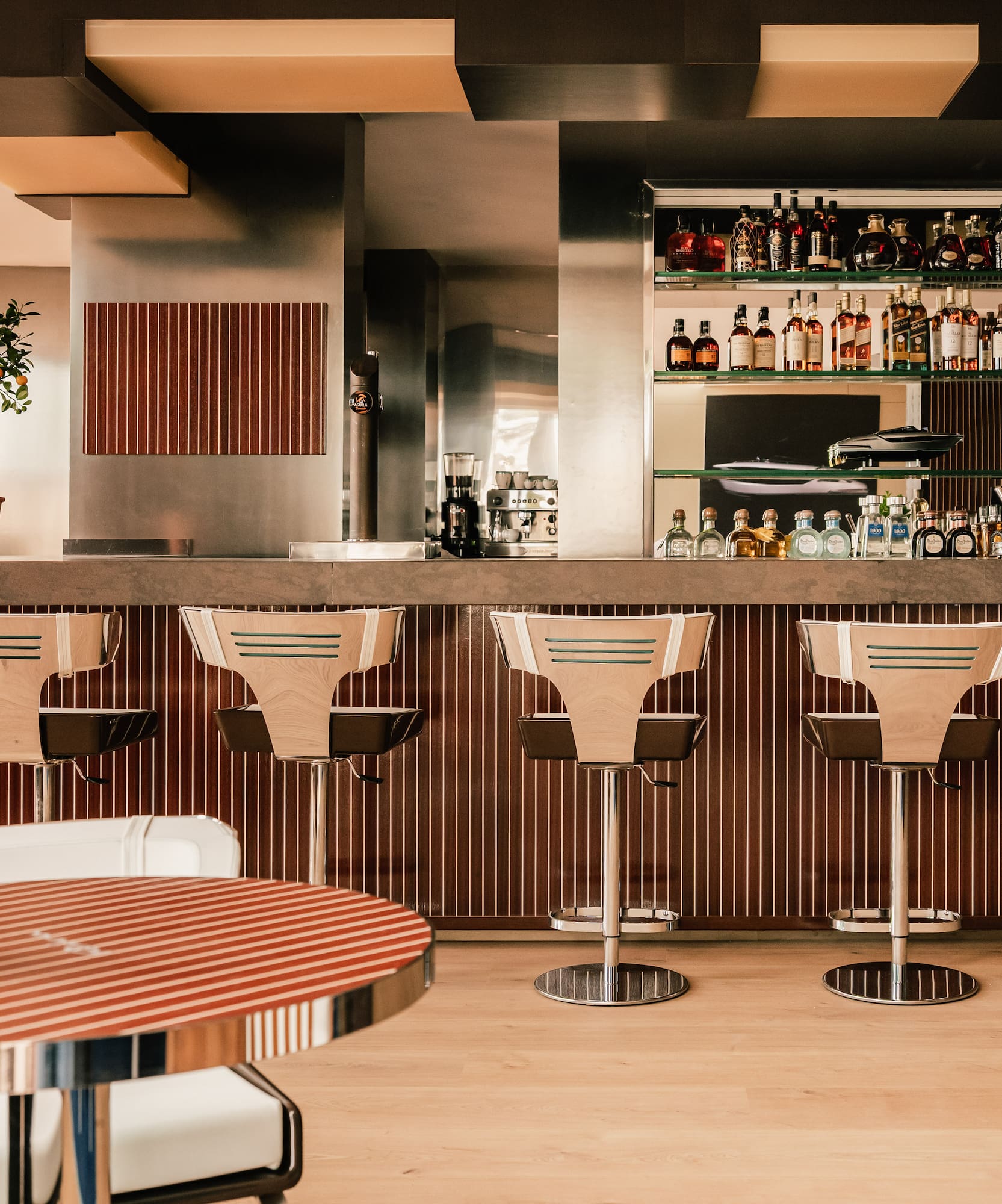a bar with chairs and a table