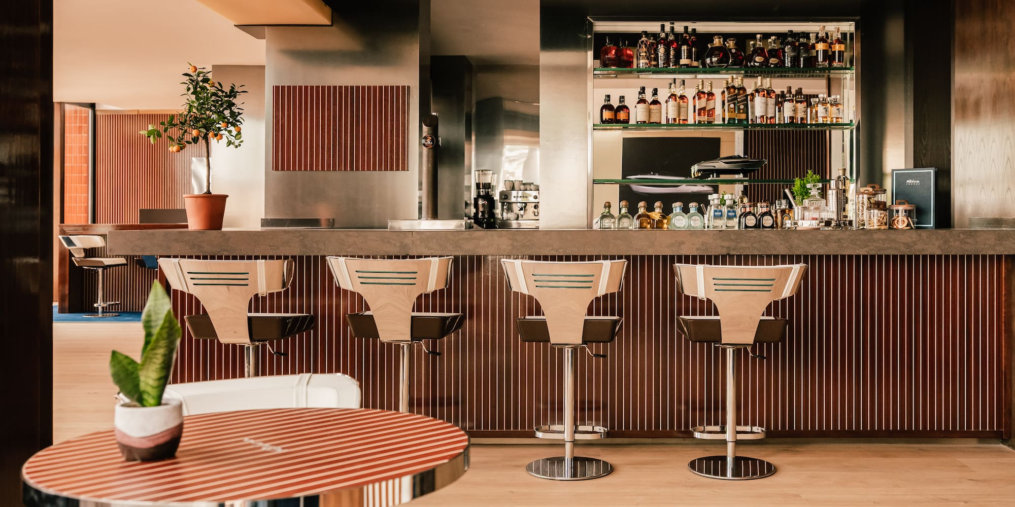 a bar with chairs and a table