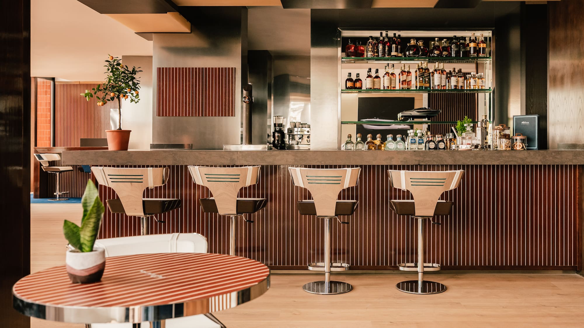 a bar with chairs and a table