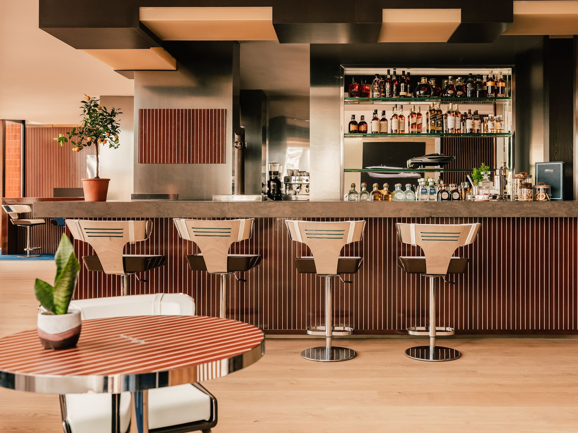 a bar with chairs and a table