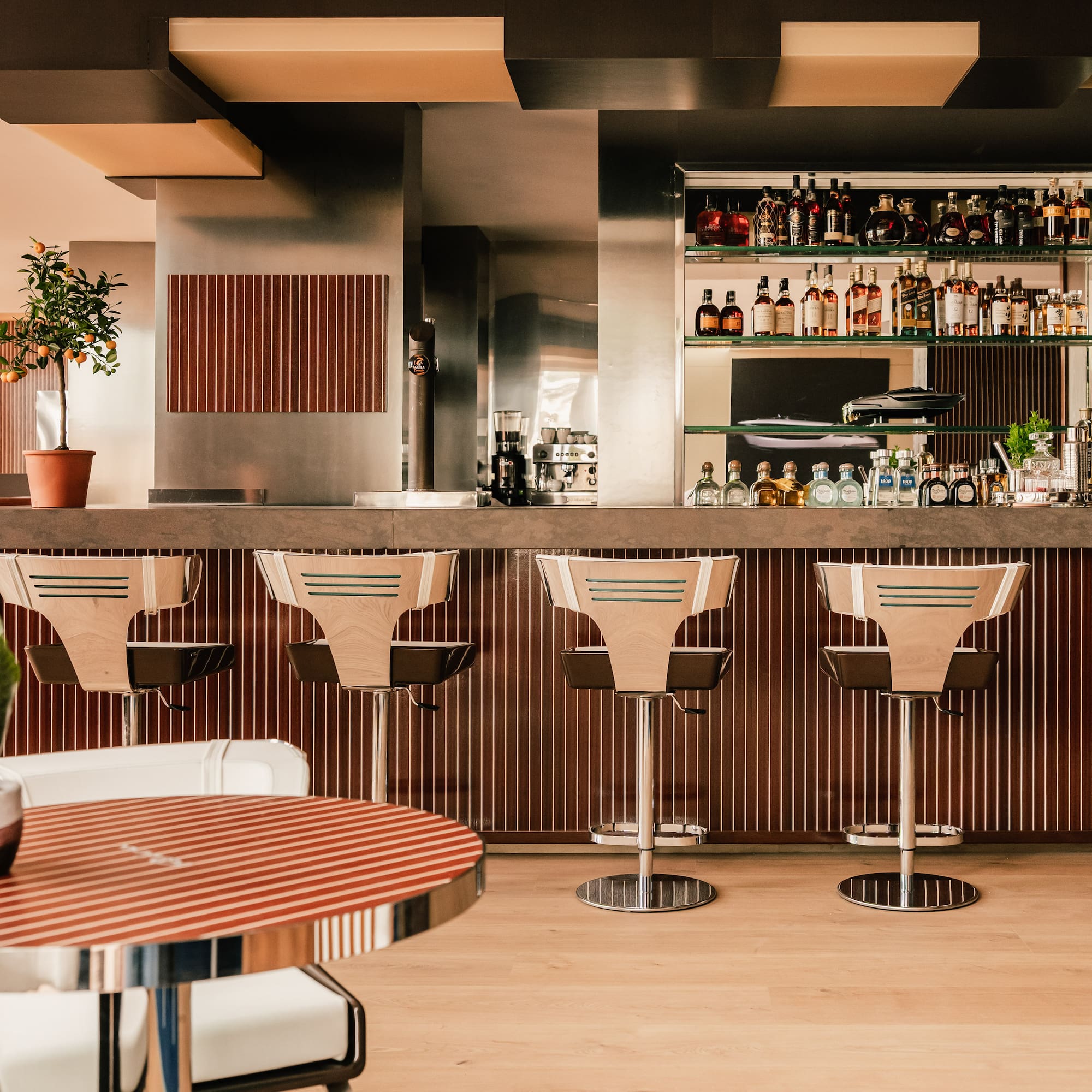 a bar with chairs and a table