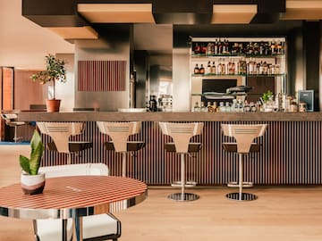 a bar with chairs and a table