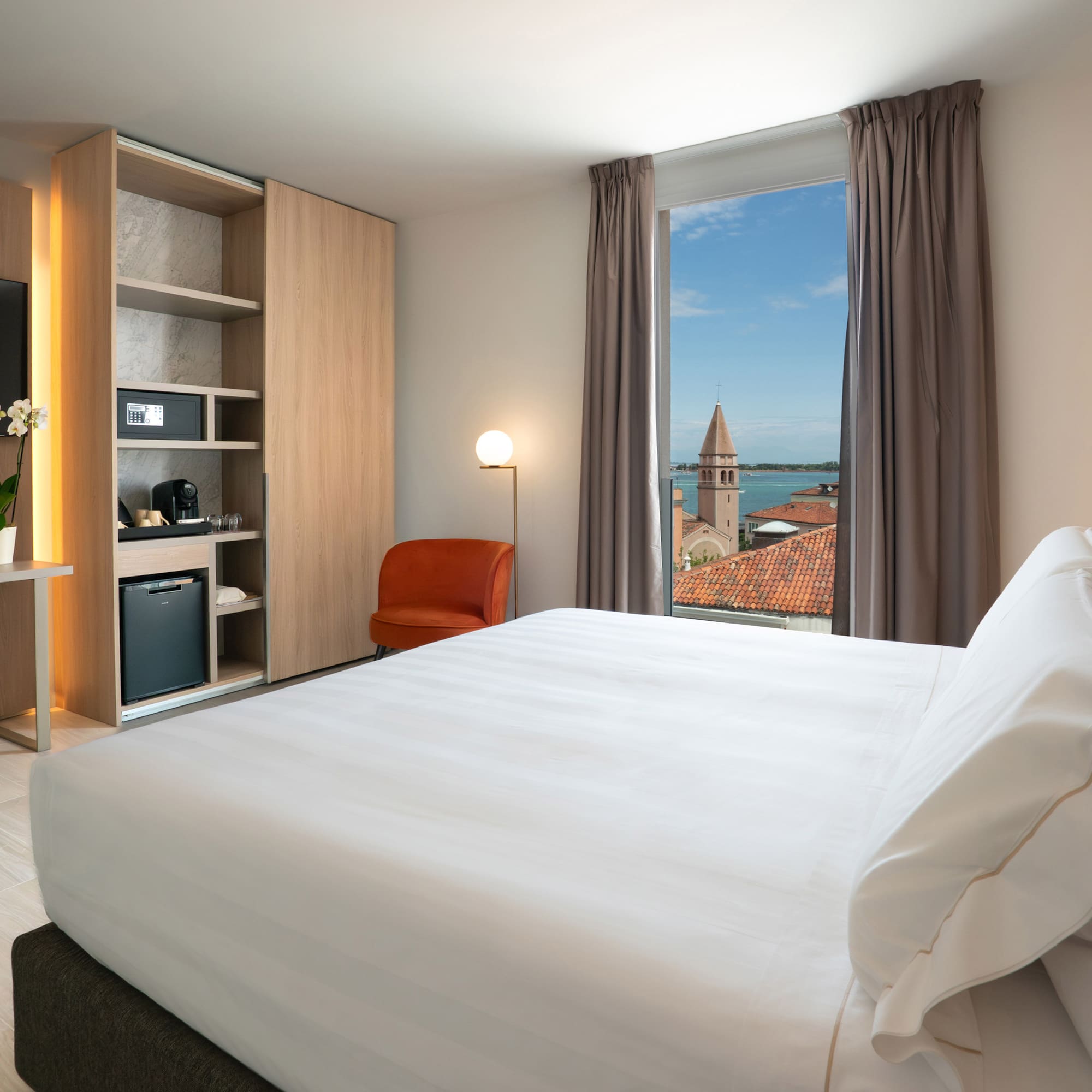 a room with a bed and a window