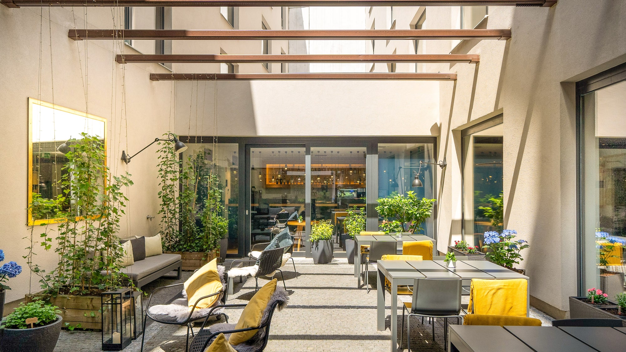 a patio area with tables and chairs