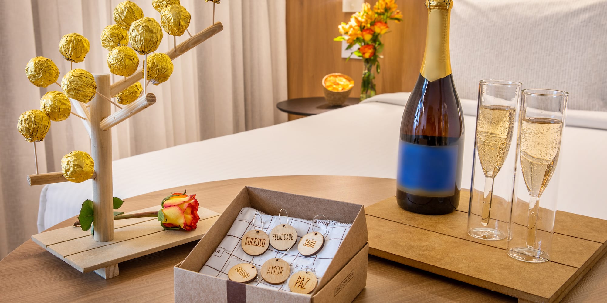 a bottle of champagne and a box of wine