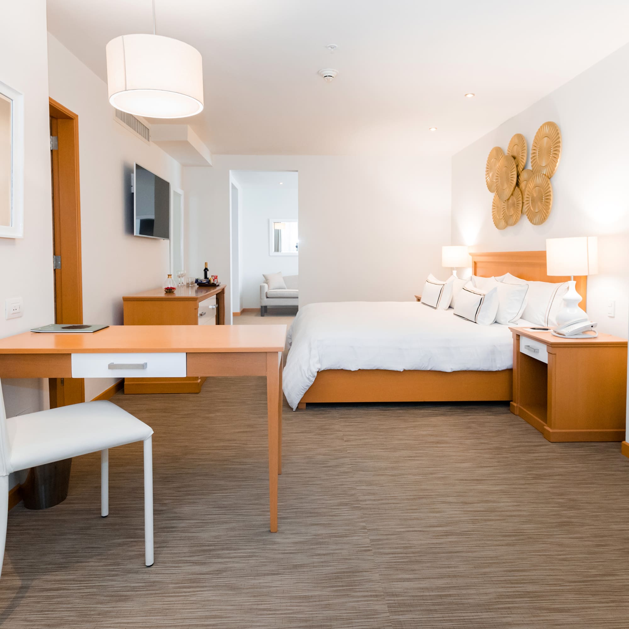 a room with a bed and a desk