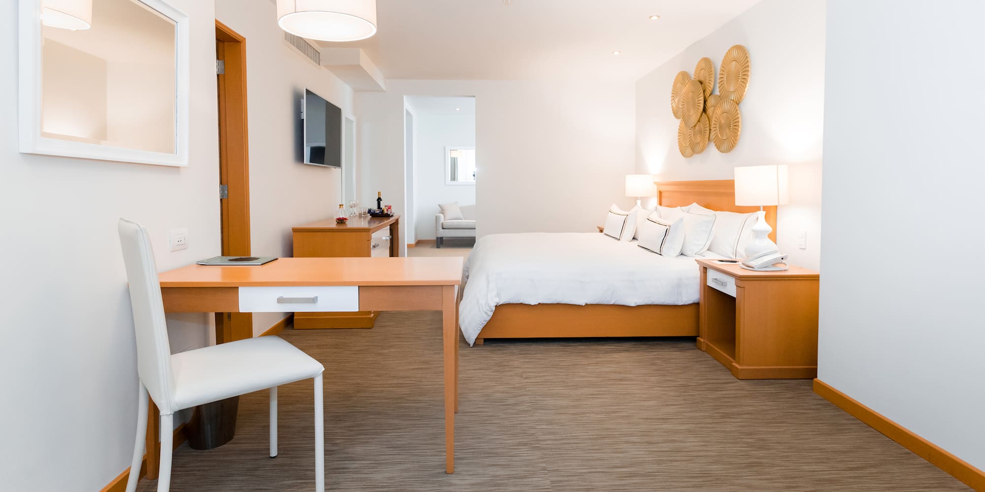 a room with a bed and a desk