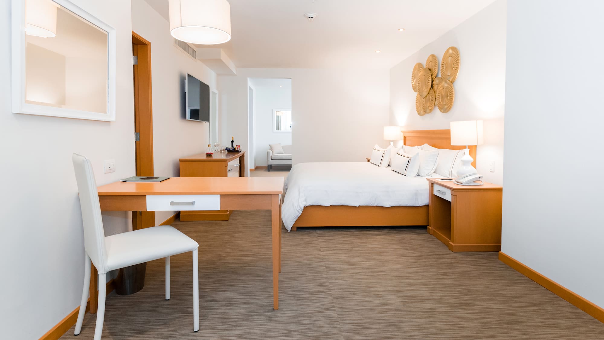 a room with a bed and a desk