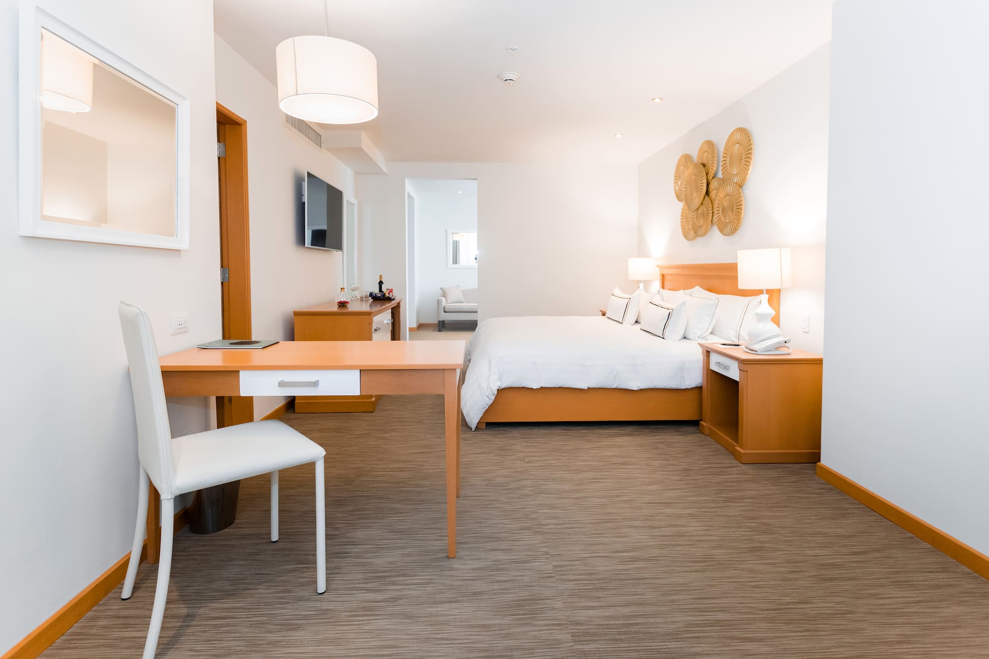 a room with a bed and a desk