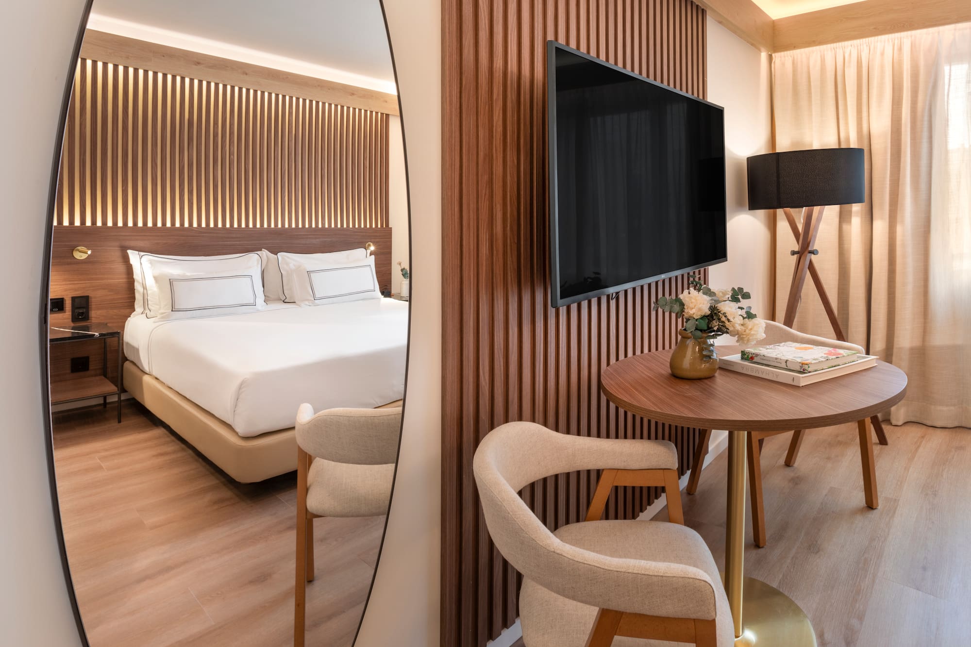 a mirror of a hotel room