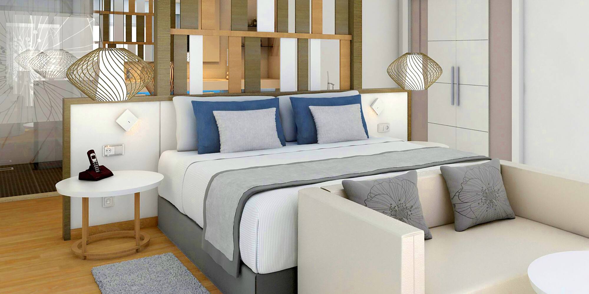 a bed with a white couch and a white table