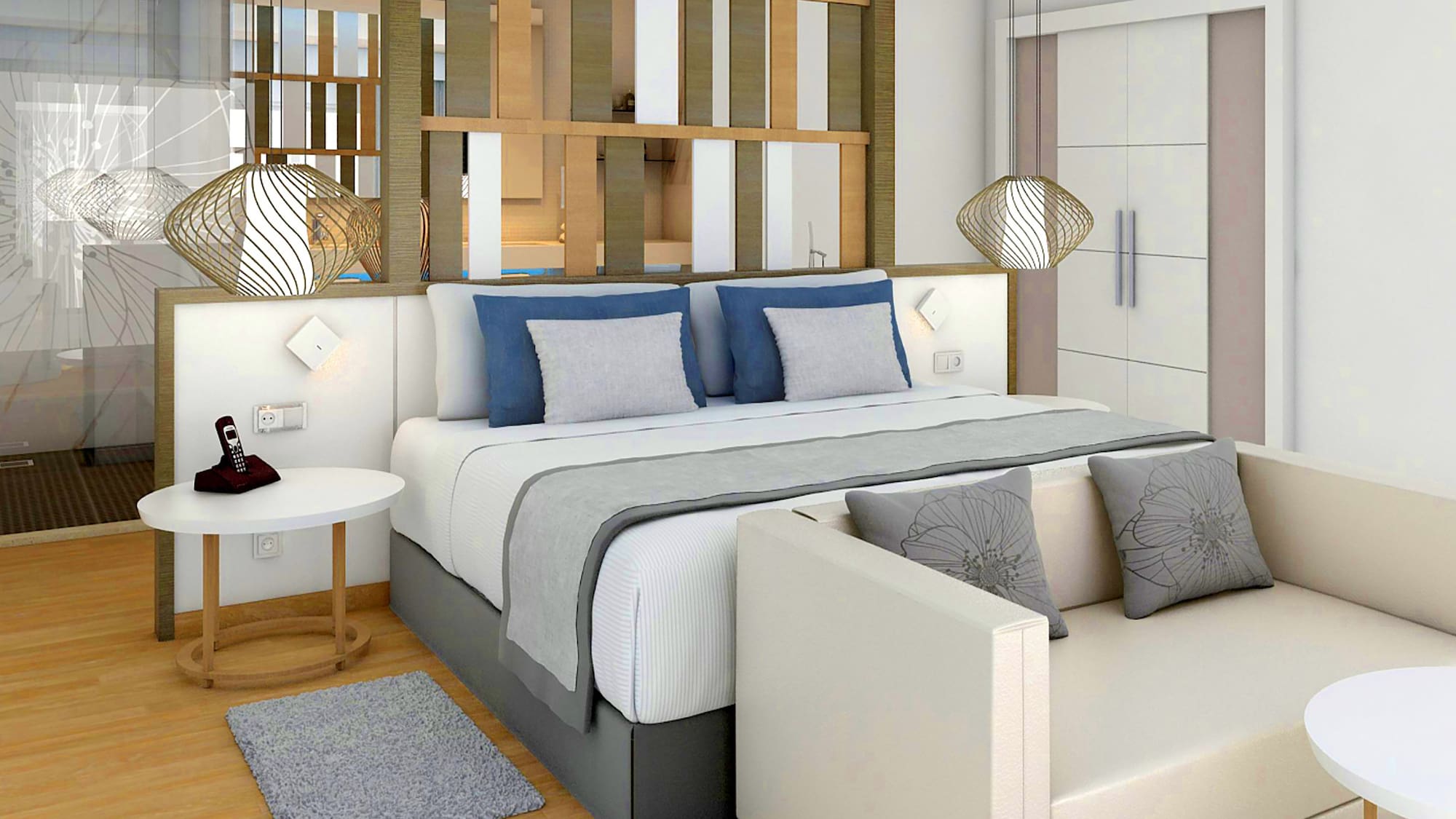 a bed with a white couch and a white table